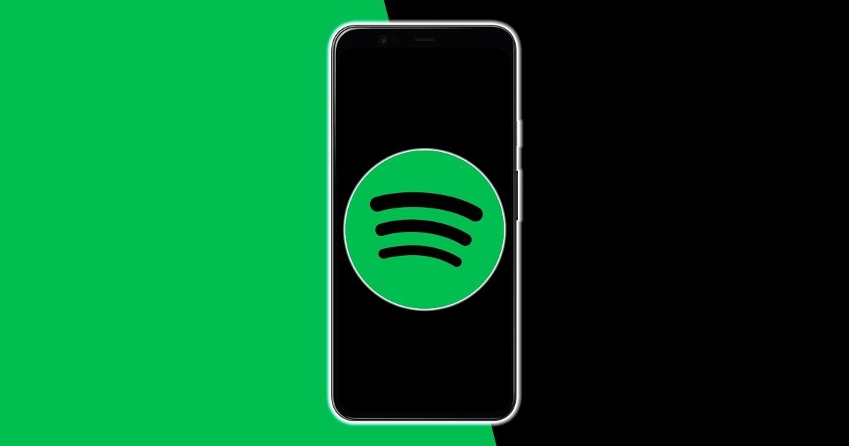 Móvil con logo de Spotify frente a fondo verde y negro