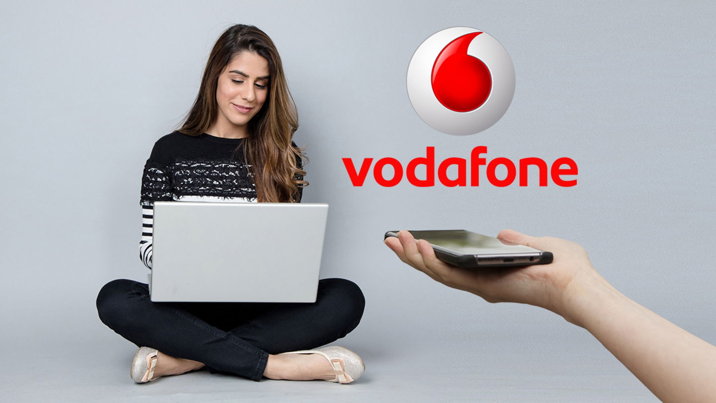 Logo de Vodafone, chica con un portatil y mano con un móvil